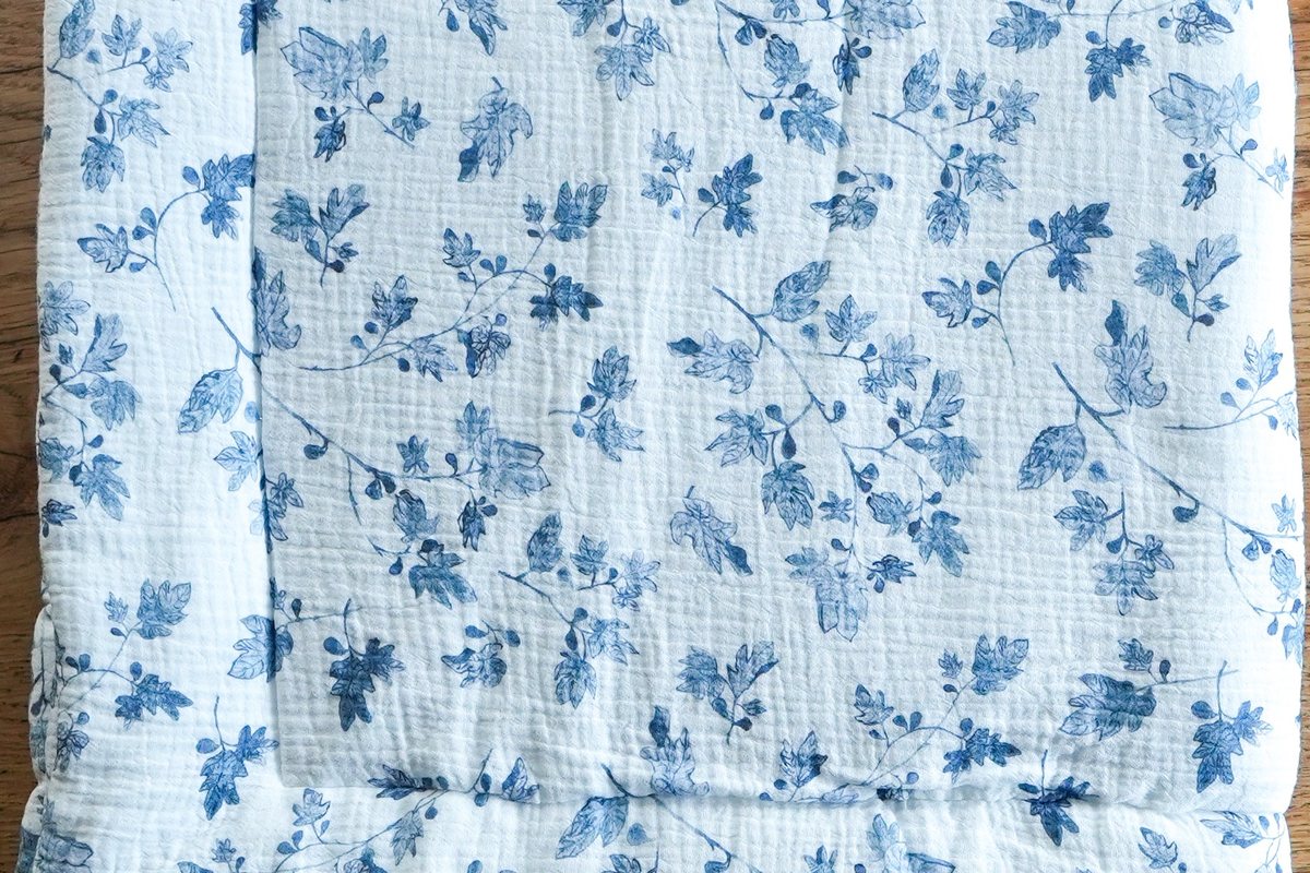 Close detail of the Fig print on muslin, pulling back to the folded cloth