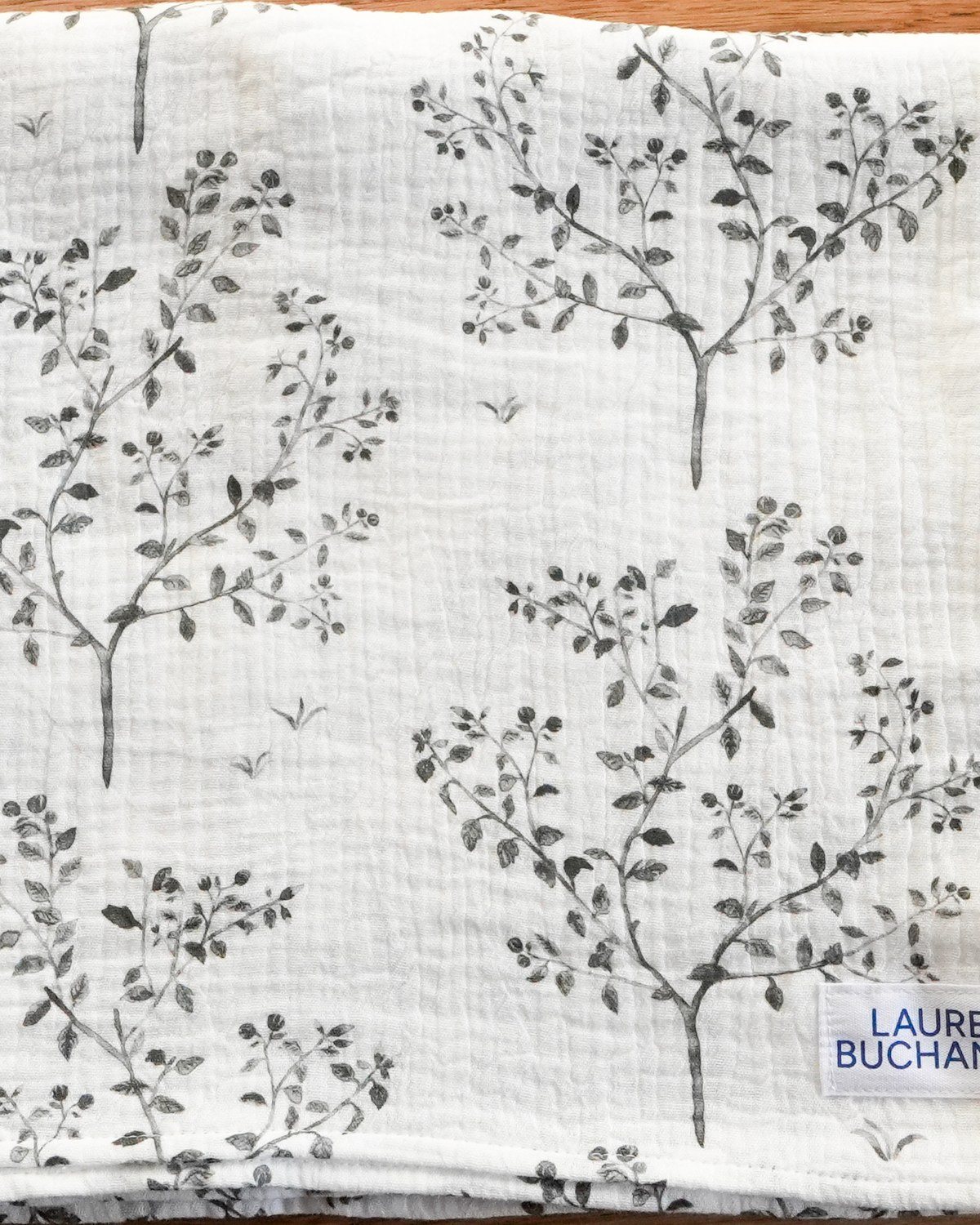 Snowberry muslin swaddle on the studio table